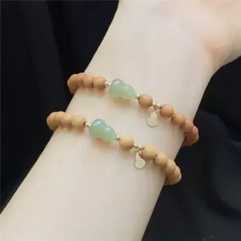 Браслет из сандалового дерева с надписью «calabash»