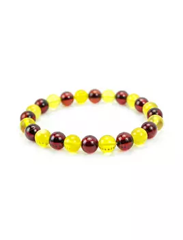 Браслет из двухцветных янтарных бусин-шаров