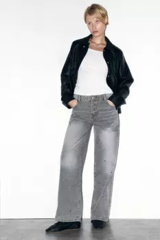 Джинсы широкие с металлическими люверсами