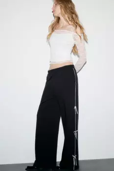 Брюки трикотажные с лампасами и бантиками