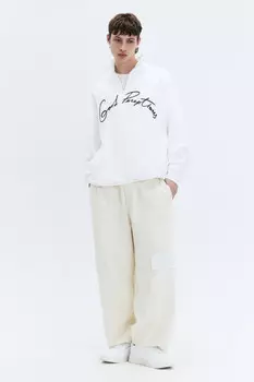 Брюки трикотажные широкие с накладными карманами