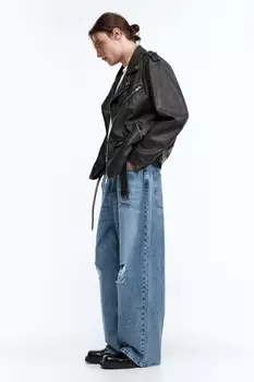 Джинсы экстраширокие с рваными коленями