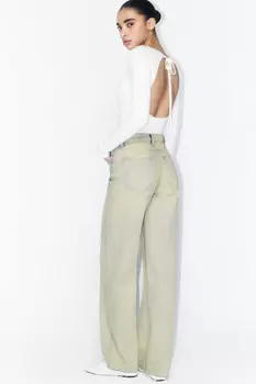 Джинсы широкие с открытыми срезами