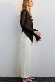 Джинсы широкие укороченные с открытыми срезами