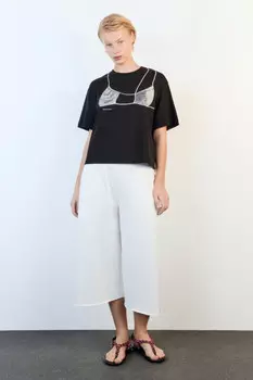 Шорты-бриджи из футера с открытыми срезами