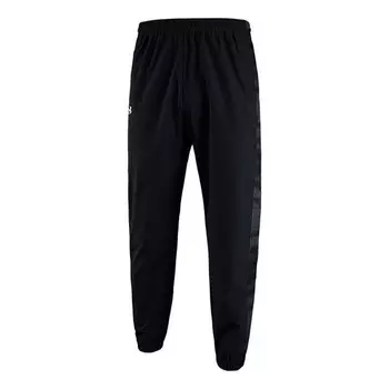 Брюки quick snap tearaway sweatpants 'black' Under Armour, черный