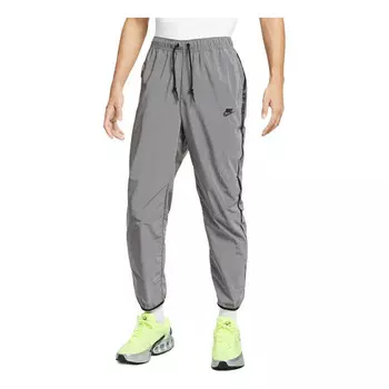 Брюки tech woven flash pants asia sizing 'reflect silver black' Nike, серебряный