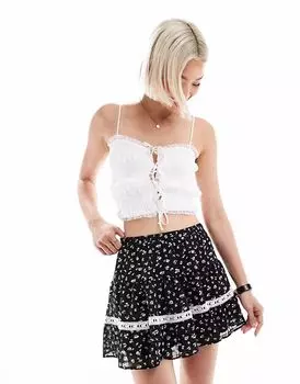 Мини-юбка New Look с цветочным принтом черного цвета