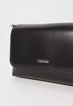 Сумка MUST STRAP MINI BAG SHINY Calvin Klein, черный