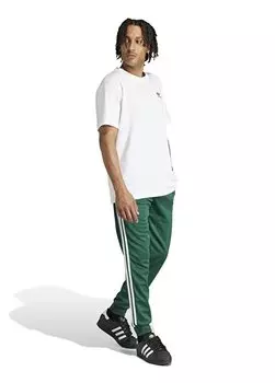 Зеленые мужские спортивные штаны IR9886 SST adidas