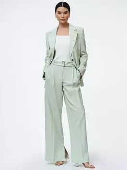 Широкие брюки со складками и разрезами внизу