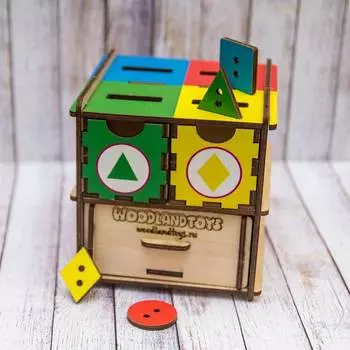 WoodlandToys Обучающий комодик "Фигуры и цвета"