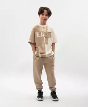 Брюки-джоггеры для мальчика из футера бежевые Gulliver