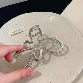 1pc Simple Ribbon Bow Hair Clip for women. Ideal for updos, it looks great at the back of the head when paired with a shark clip