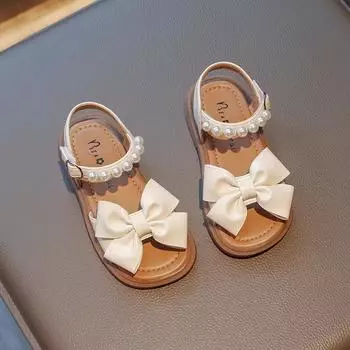 Детская обувь Bow Pearls Open-toe 2024 Новые летние туфли на плоской подошве для детей Повседневные сандалии для девочек Нескользящие PU простые японские сандалии для платьев 22 чёрный