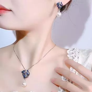Ювелирные изделия Новые жемчужные серьги S925 Silver Needle White Pearl Серьги Ожерелье Подвеска Мода Серия из черного золота
