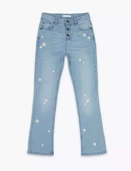 Джинсы из хлопка, декорированные вышитыми ромашками