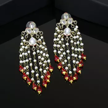 White pearl drop hangings from kundan tops