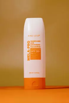 Солнцезащитный крем с транексамовой кислотой NINE LESS MELA-PRO Tranexamic Acid Sun Screen SPF 50PA++++ 100ml