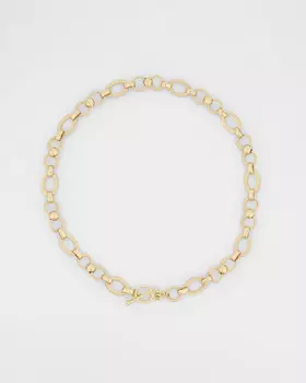 Колье-цепь с фактурными звеньями разных форм и размеров и орнаментом на них с застежкой тогл