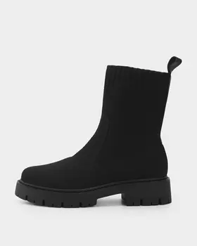 Утепленные ботинки на устойчивом каблуке и тракторной подошве