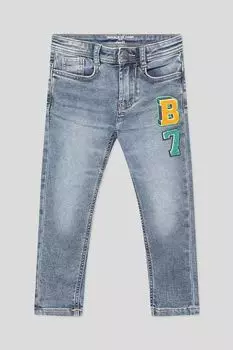 Джинсы с эффектом потертости и принтом OVS