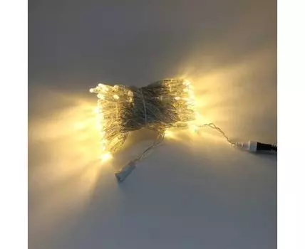 Гирлянда Нить с Колпачком 10м Тепло-Белая с Мерцанием Белого Диода 24В, 100 LED, Провод Прозрачный ПВХ, IP65