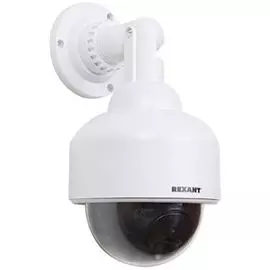Муляж камеры видеонаблюдения Rexant 45-0200 Неотличим от обычной камеры. Мигающий красный светодиод (каждые 5 секунд) Питание: батарейки AА - 2шт. Мат