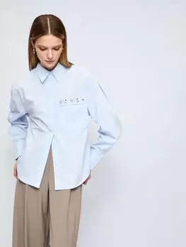 Рубашка с объёмными рукавами и акцентом на кармане