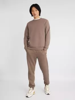 Утеплённые трикотажные брюки-джоггеры в спортивном стиле