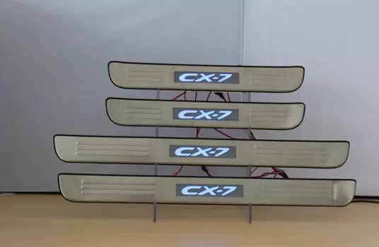 Накладки на дверные пороги с логотипом и LED подсветкой (нержавеющая сталь) JMT 24385 Mazda CX-7 2007 - 2012